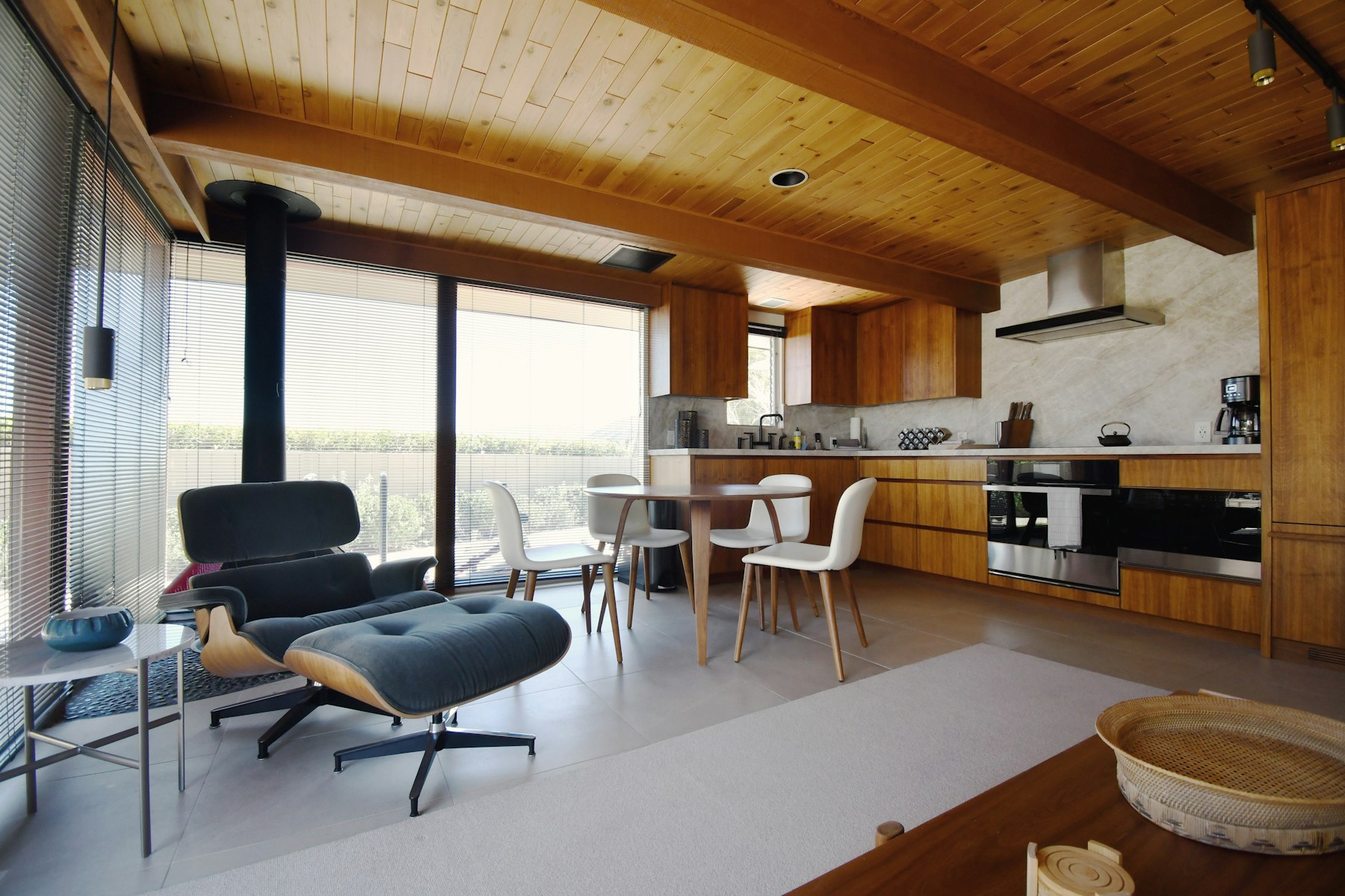 Palm Springs midcentury guesthouse with warm wood finishes and open living space